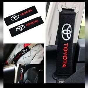 COPY - 2 new Toyota embroidered seat belt covers.